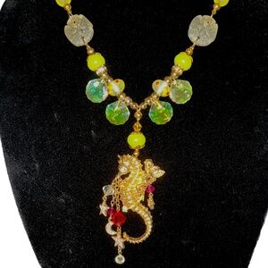 #50. VTG/RETIRED KIRKS FOLLY BROOCH/PENDANT ON GLASS BEADED GOLDTONE SNAKE CHAIN